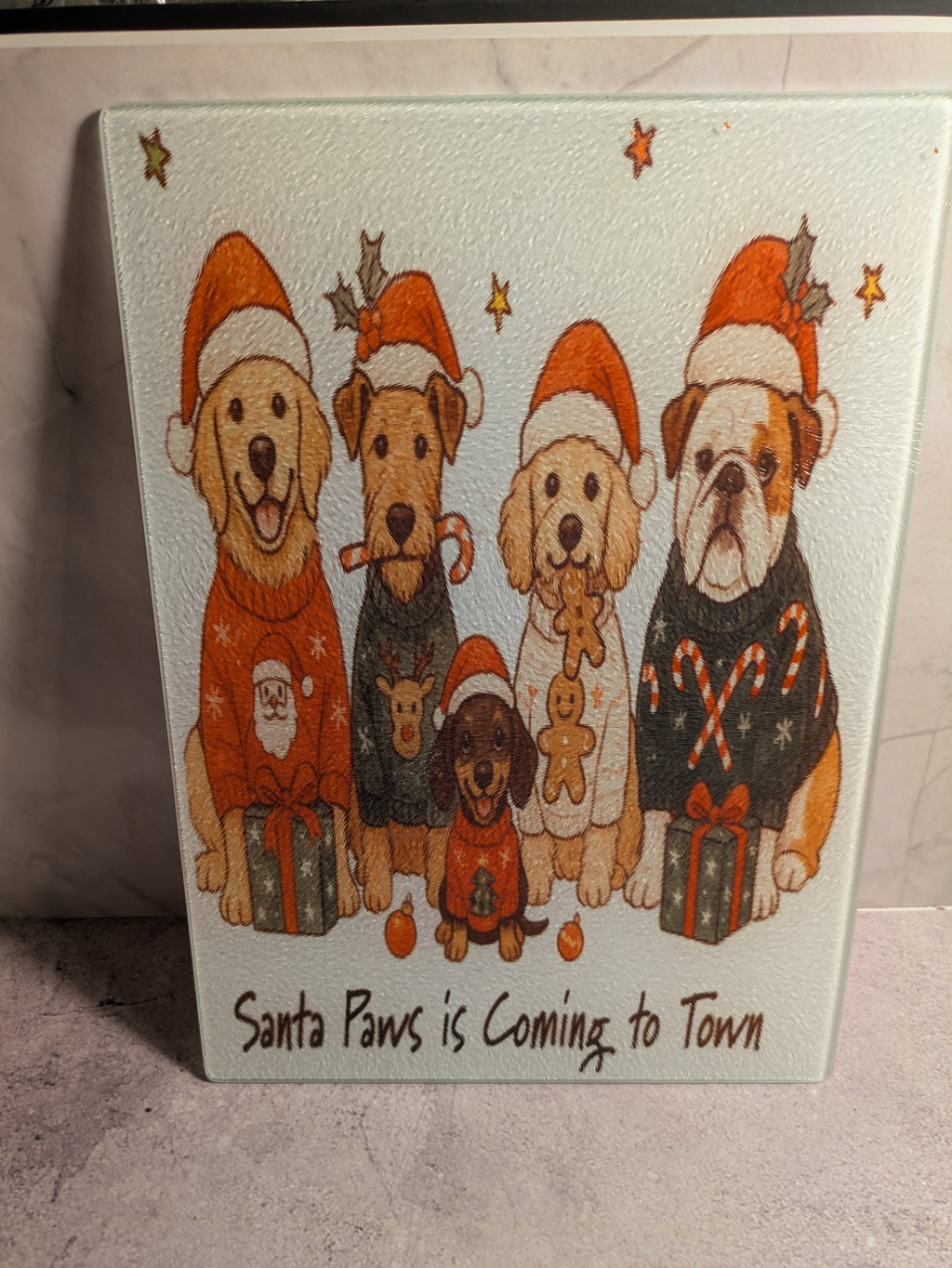 Santa Paws is Coming to Town glass cutting board front view