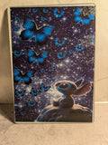 Celestial bunny and blue butterflies glass cutting board close-up