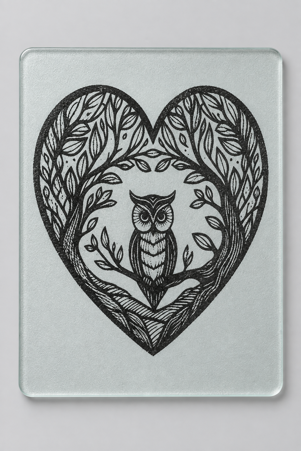 Laser engraved owl heart glass cutting board - close-up detail